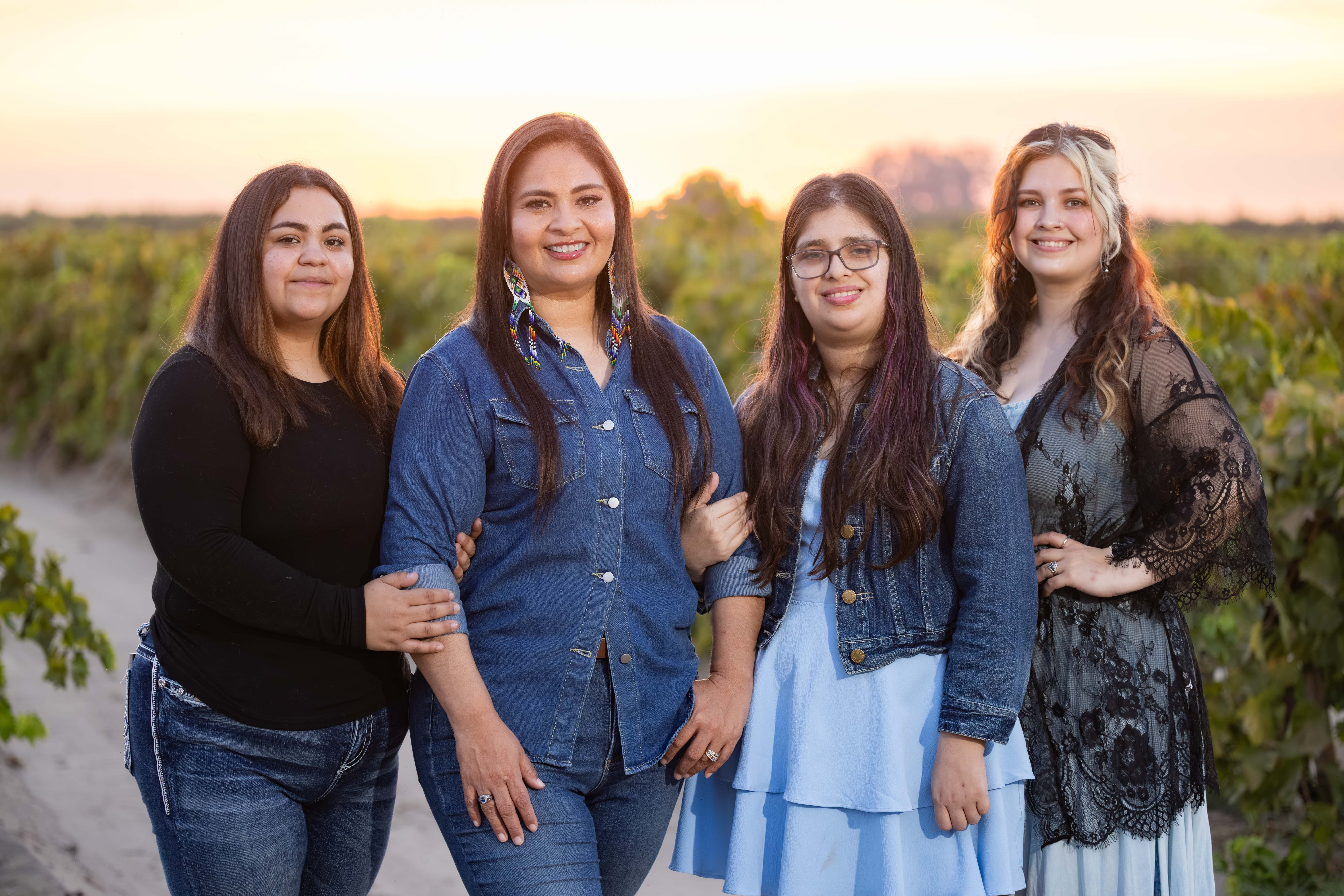 Maria Pacheco with her daughters in a Fresno County vineyard
